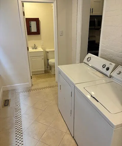 Convenient first floor laundry room and full bathroom in back of house