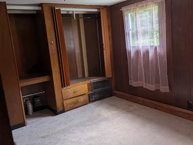 Master bedroom, double windows, double closets, small desk. New carpet.