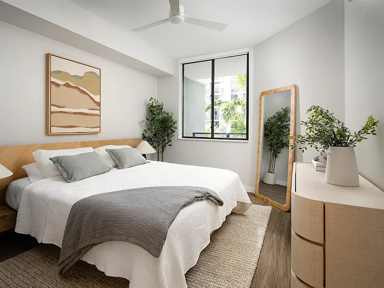Primary bedroom with hard-surface vinyl plank flooring