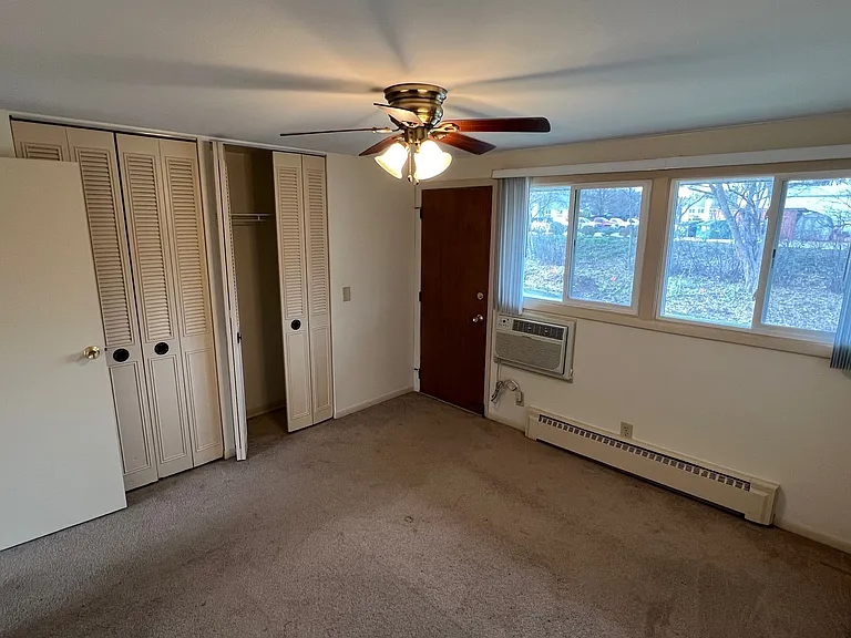 Carpeted bedroom with A/C