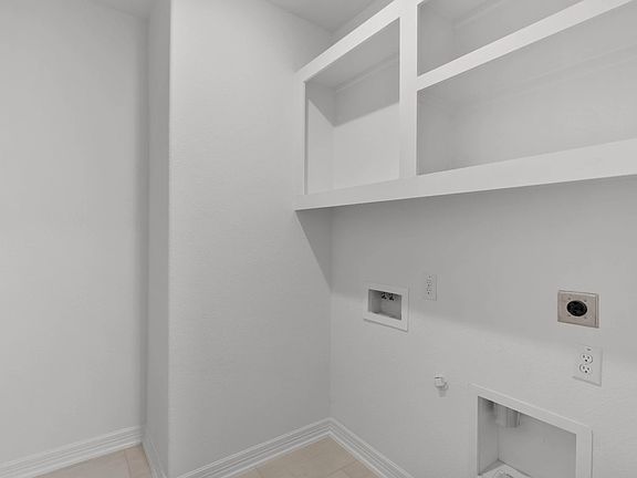 Utility room. Note Sample product photo - actual exterior and interior selections may vary by homes