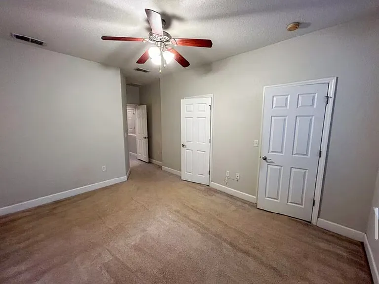 Primary bedroom with double walk-in closets
