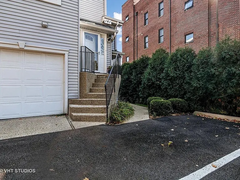 Stairs to second floor unit.