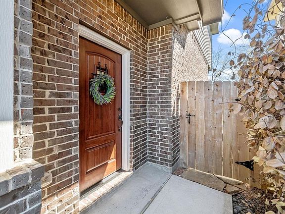 Private front entry and handsome front door is a wonderful place to greet guests.