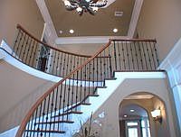 Two story foyer with leaded glass doors and travertine flooring. 