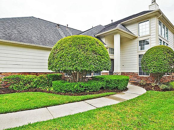 Lush landscaping gives this home great curb appeal