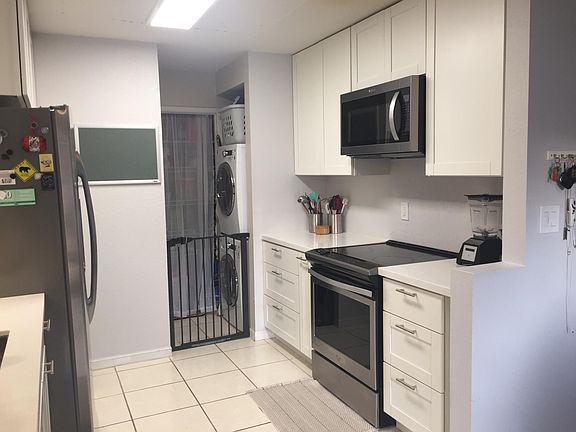 Newly installed washer/dryer and spacious pantry at the end of the kitchen.