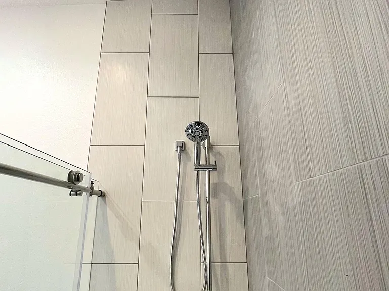 Modern tiled shower with rainfall & handheld shower head