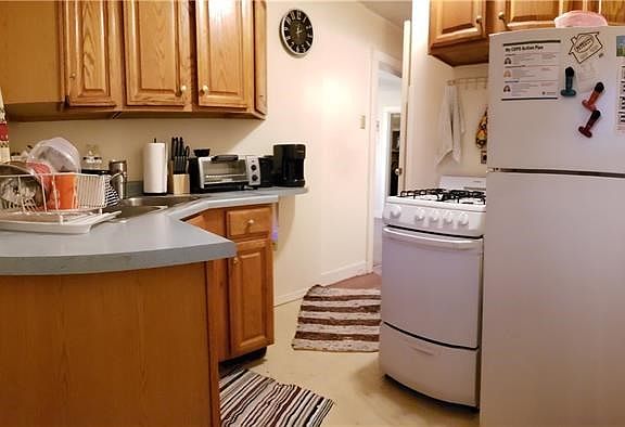 Unit 1 Kitchen with Access to Back Yard and Parking