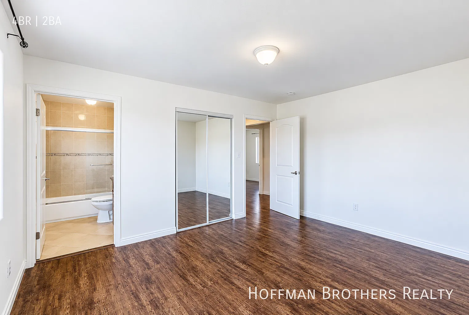 Renovated Townhouse with Open-Concept Living, Porch, In-Unit Laundry And Parking — Photo 4