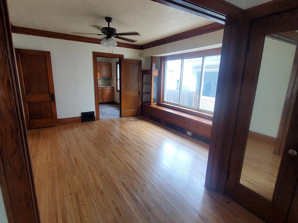 View from living room into dining room and kitchen