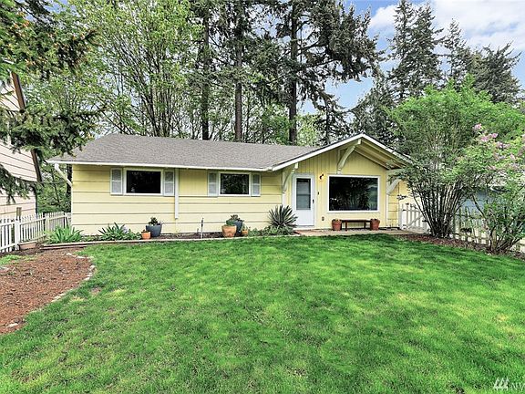Quaint little rambler. Front yard hosts pear, cherry and apple trees. 