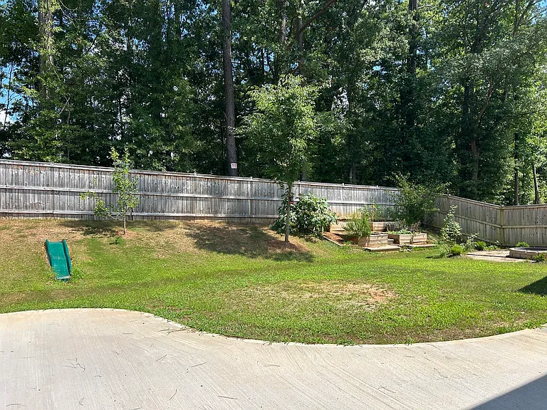 Extended patio, garden beds, fruite trees, fire pit.