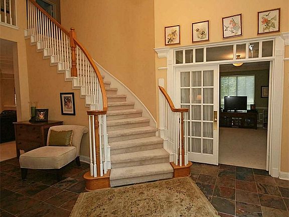 The study has French doors and a transom window above. This was originally the dining room but it works as a study too.