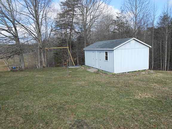 Shed, sandbox, swingset