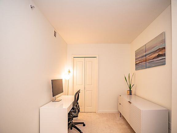 Den off of entry, large enough for a twin guest bed, office, or workout room