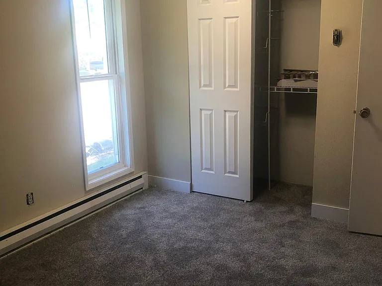Smaller of 2 Bedrooms. Both bedrooms have simple closet organizer.