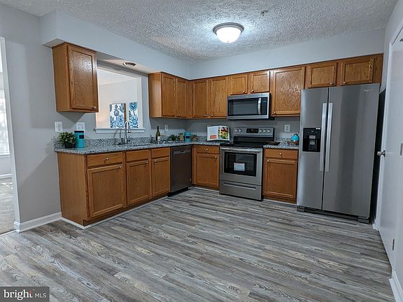 5th image of 207 Woodland Green Way