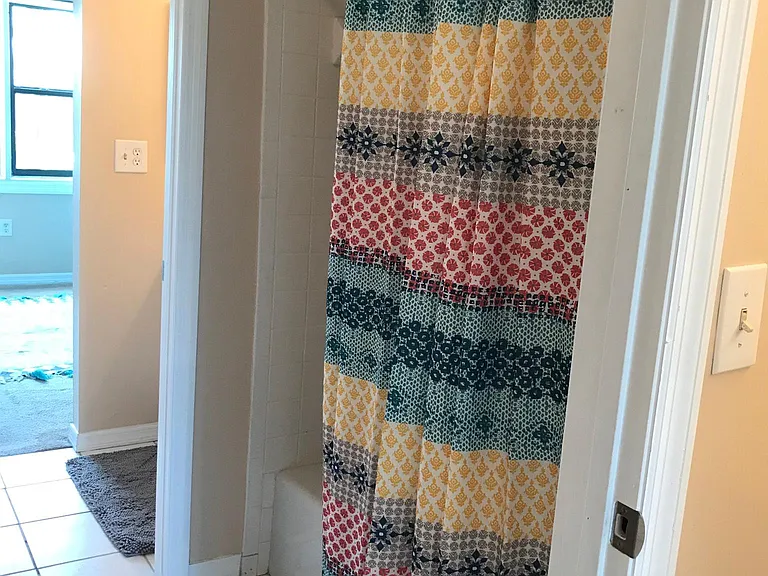 Upper level bath and shower room shared by bedrooms.