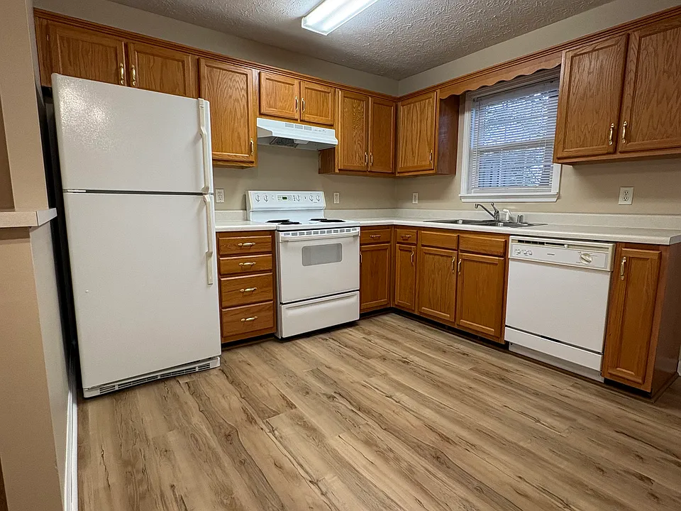 Kitchen area, refrigerator, dishwasher stove, new flooring