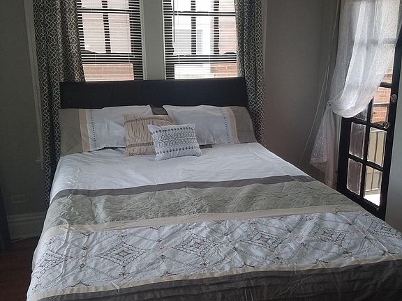 Bedroom with Lots of natural light. The south door leads to balcony.