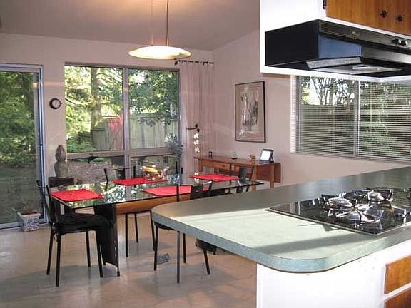 The spacious dining area even has room  for a cozy couch or additional seating