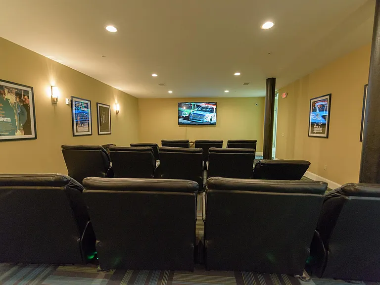Theatre room with big screen TV & cinema-style seating