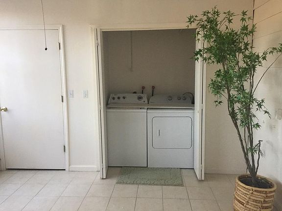 washer and dryer in sunroom
