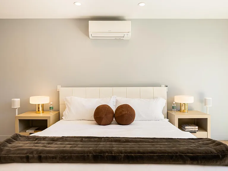 Featuring a lush bed adorned with crisp, fresh linens.
