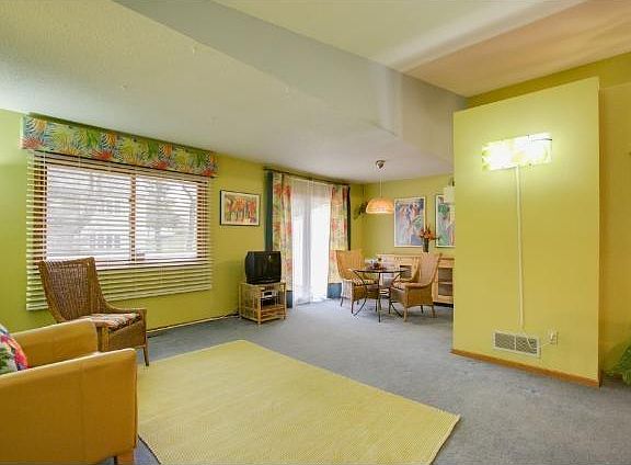 Open floorplan living area with beautiful tropical design! (newer neutral carpet now in place)
