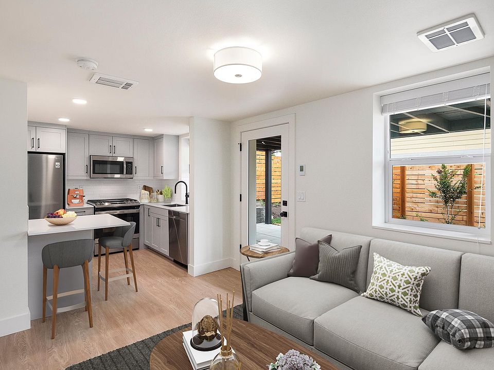 Sun filled living room and eat in kitchen.