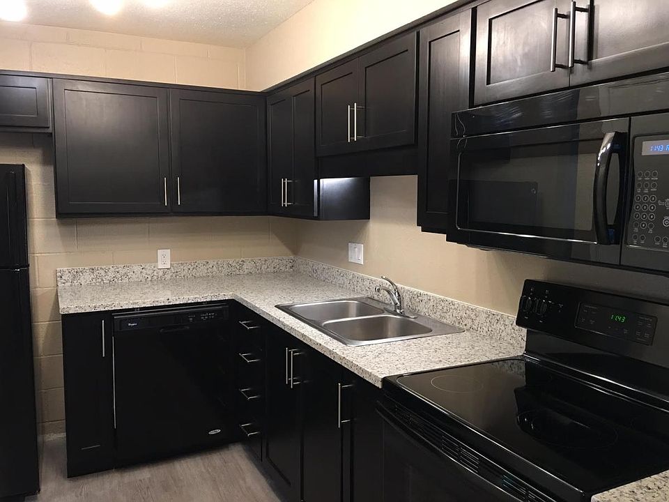 Pearl white granite w/cappuccino cabinets.