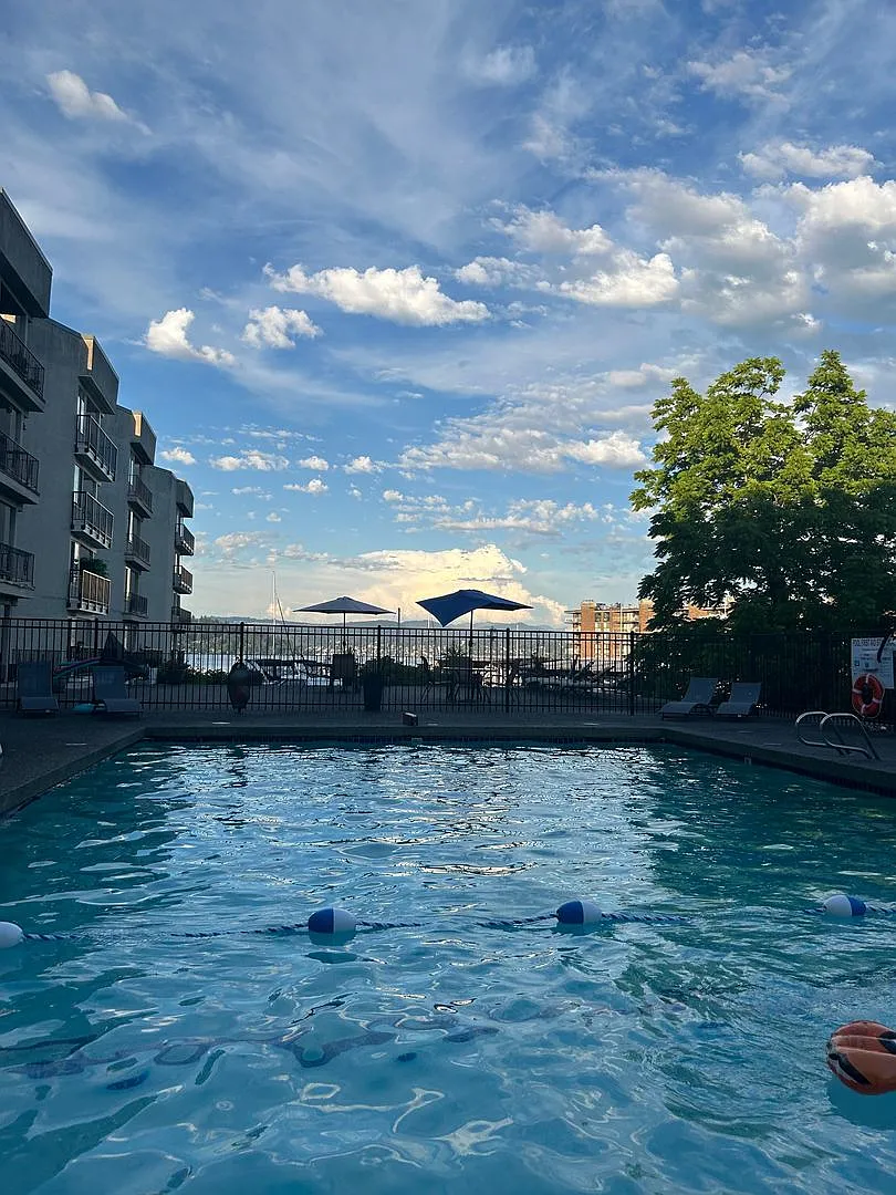 Updated 2-Bedroom Condo with Water Views, 2 Parking Spaces & Poolside Location — Photo 1
