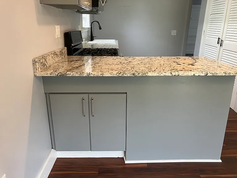 Granite breakfast bar with storage.