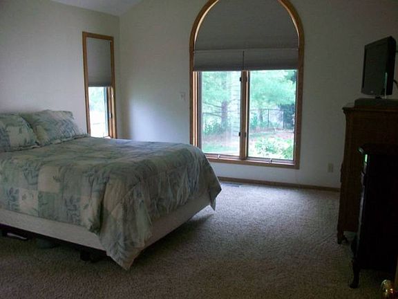 Master bedroom with custom made blinds that darken when it gets lighter outside.