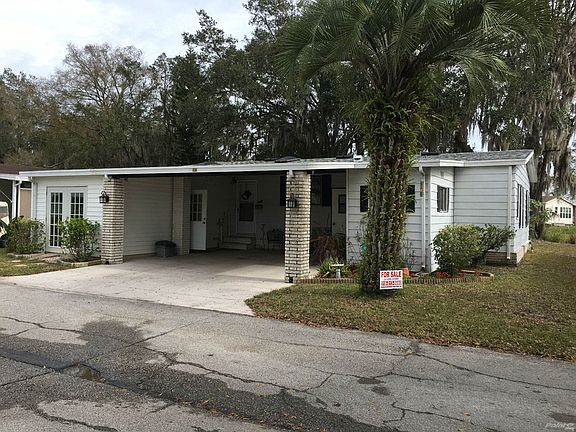 Front of Home with Attached Carport
