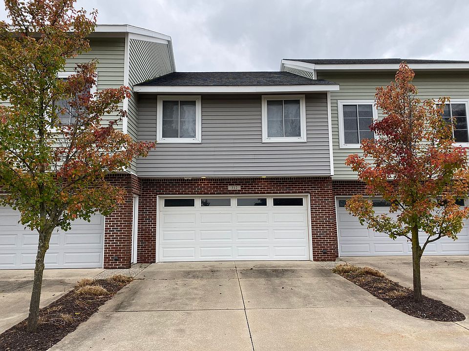 Back of Condo with Garage