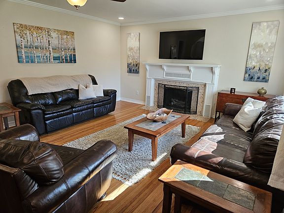 Living room with ample seating and large SmartTV