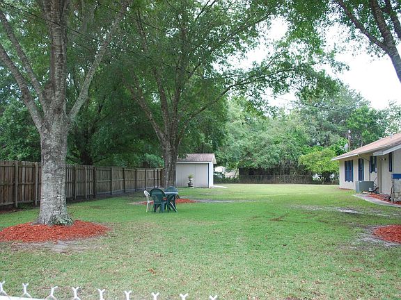 Storage shed on side of home
