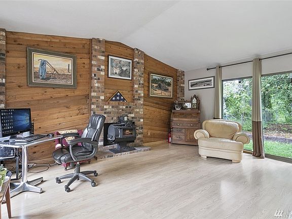 Large living room with tons of natural lighting. 