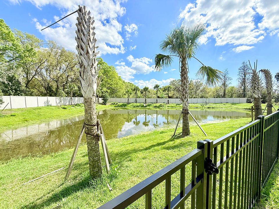 Private Pond view from fenced back yard