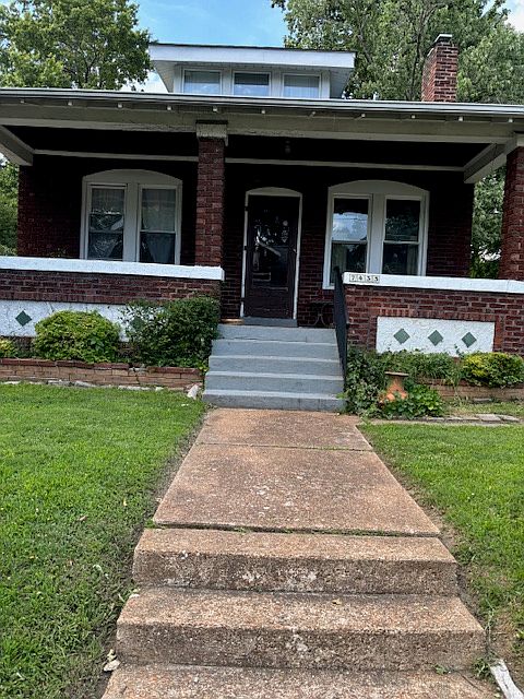 Front entrance. Large porch.
