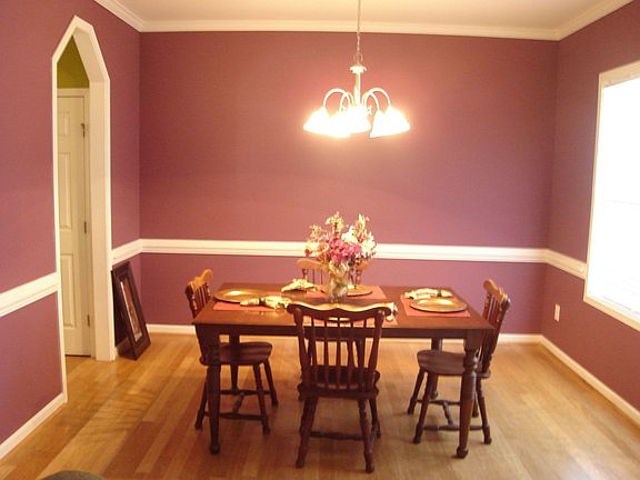 Large dining room has large windows to let in plenty of natural light.