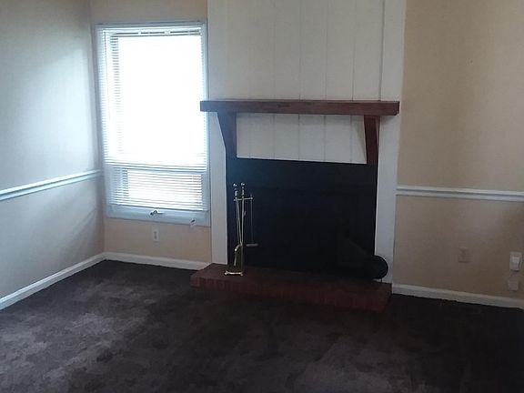 Wood burning fireplace in living room