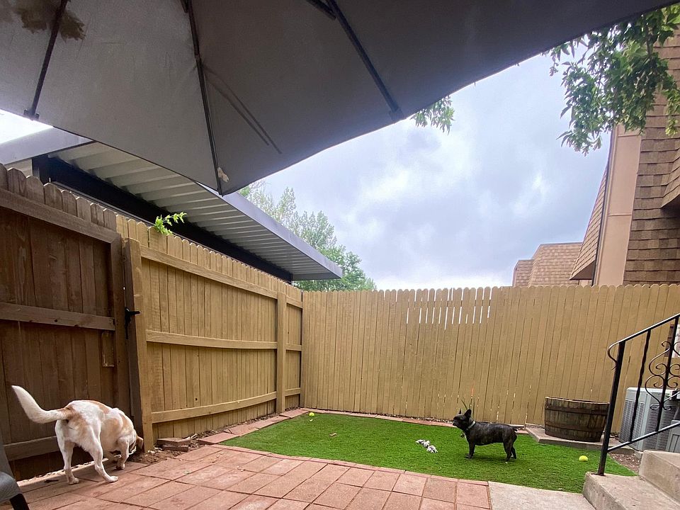 Artificial turf in fenced front yard