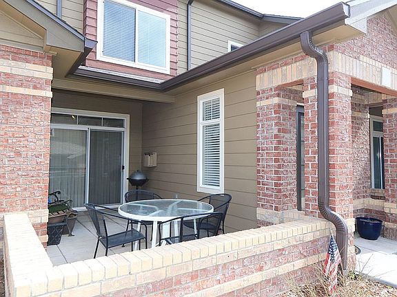 Large patio, with entrance off of dining room.  Great for grilling and chilling.  View from patio out to golf course and front range mountains.  Patio is completely enclosed (most are not).