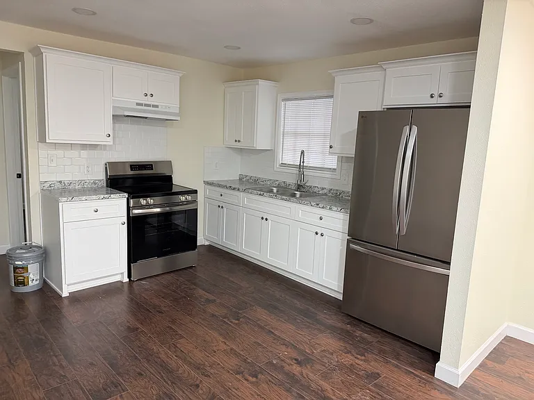 Kitchen area with new appliances