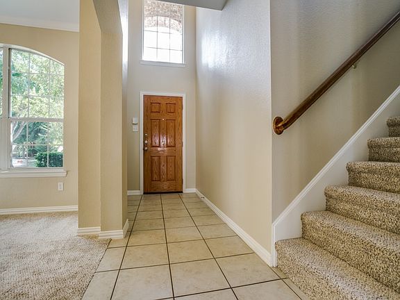 Open and Well Lit Foyer with High Ceilings and Ceramic Tiles