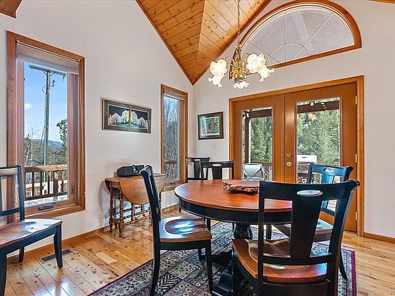 Eat-in kitchen dining space, patio doors to front deck, gas grill.