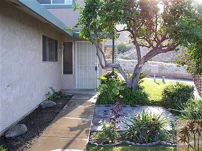 Private patio located to right of front door. view of direct access to 26 miles of hiking and biking trails.